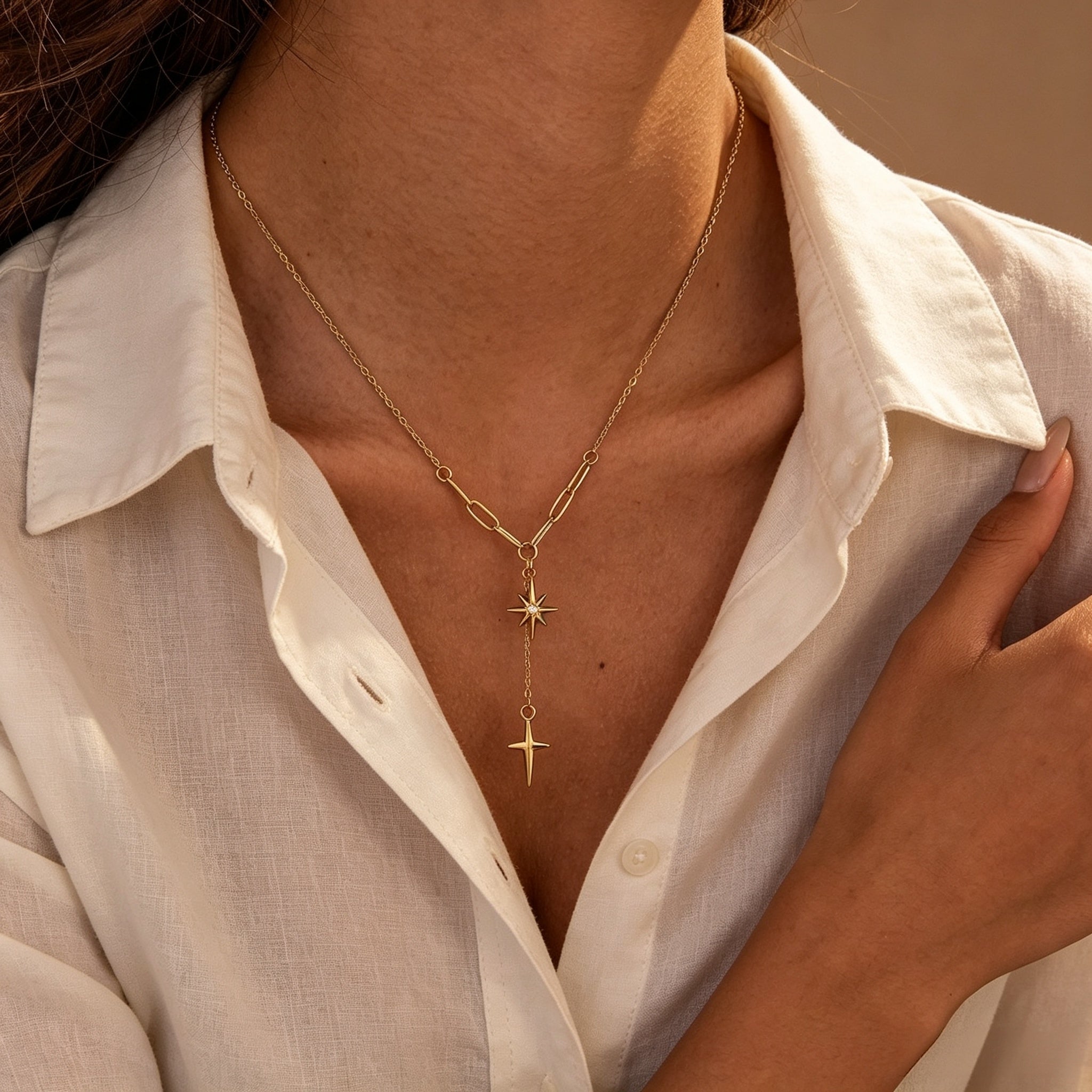 Gold star pendant necklace with layered chain, perfect for everyday wear or gifting