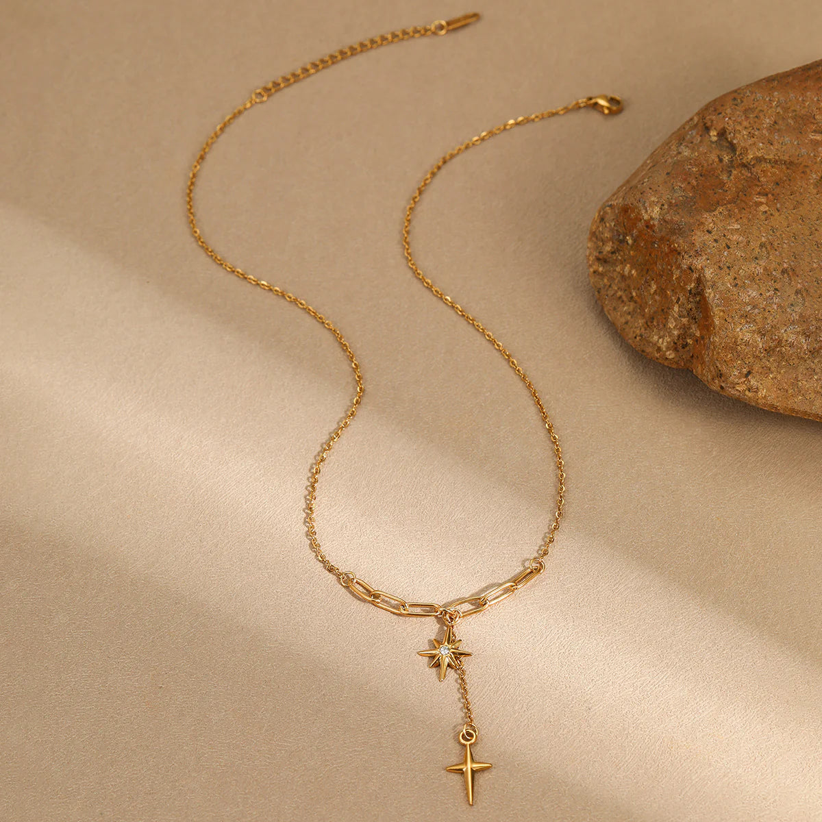 Gold star pendant necklace with delicate chain, perfect for everyday wear or gifting