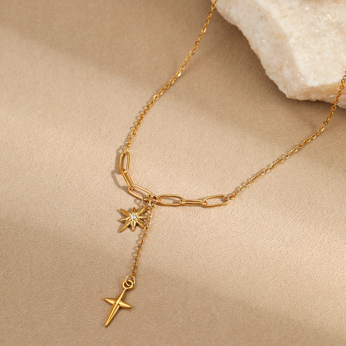 Gold star pendant necklace with delicate chain, perfect for everyday wear or gifting